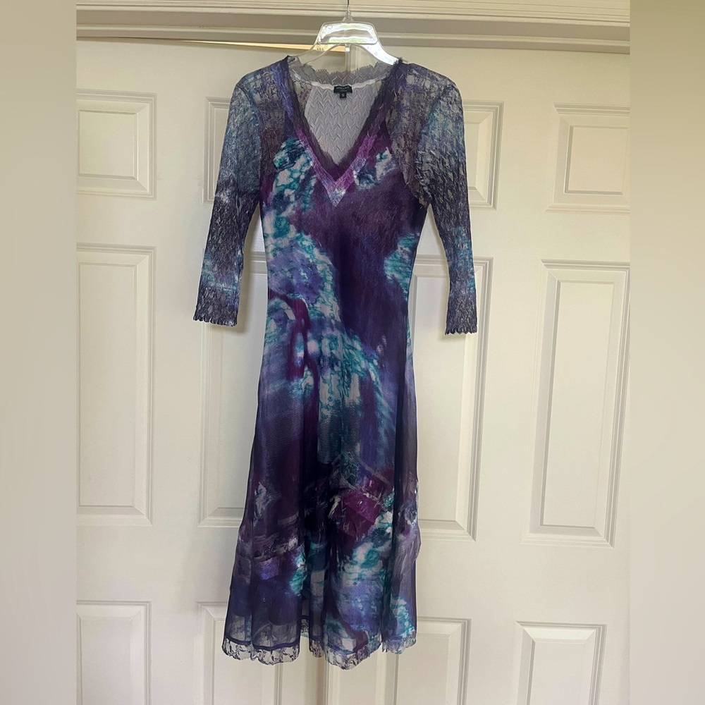 Komarav midi, open weave lace 3/4 length sleeves. Flattering, travels well.